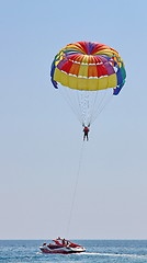 Image showing Parasailing in a blue sky