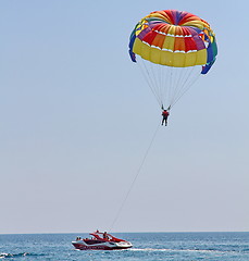 Image showing Parasailing in a blue sky