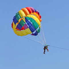 Image showing Parasailing in a blue sky