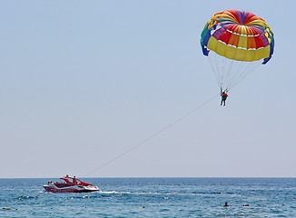 Image showing Parasailing in a blue sky