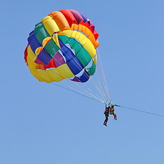 Image showing Parasailing in a blue sky