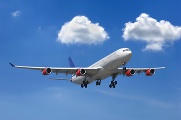 Image showing Big airliner and clouds