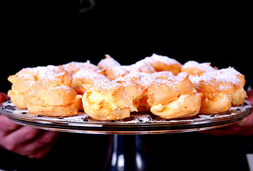 Image showing Serving delicious cakes on a plate