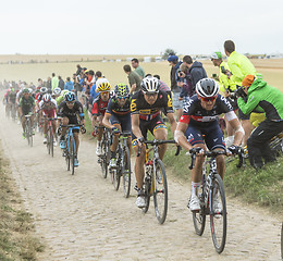 Image showing The Peloton on a Cobblestones Road - Tour de France 2015