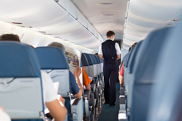 Image showing Steward on the airplane.