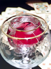 Image showing Broken glass, wine and cards