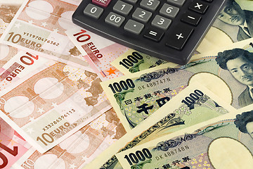 Image showing Forex - Euro and Japanese currency pair with calculator

