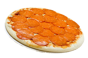 Image showing Uncooked pepperoni and cheese pizza

