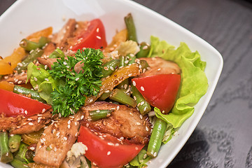 Image showing Warm salad with chicken