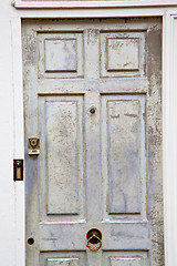 Image showing handle in london  door  rusty  brass  light