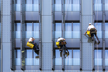 Image showing Three window washers