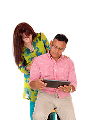 Image showing Couple playing with tablet computer.