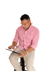 Image showing Man working with his tablet computer.