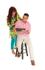 Image showing Couple looking at there tablet computer.