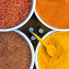 Image showing Oriental spices in white ceramic bowls