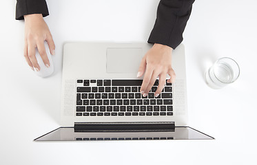 Image showing Woman writes on a laptop