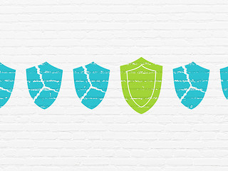 Image showing Security concept: shield icon on wall background