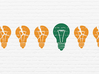 Image showing Business concept: light bulb icon on wall background