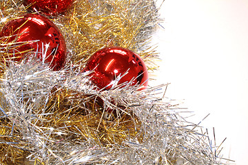 Image showing red baubles and tinsel