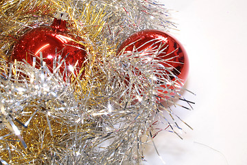 Image showing red baubles and tinsel