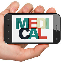 Image showing Health concept: Hand Holding Smartphone with Medical on display