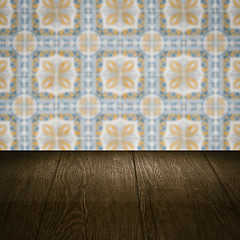 Image showing Wood table top and blur vintage ceramic tile pattern wall