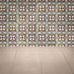 Image showing Wood table top and blur vintage ceramic tile pattern wall