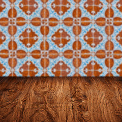 Image showing Wood table top and blur vintage ceramic tile pattern wall