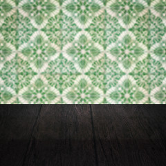 Image showing Wood table top and blur vintage ceramic tile pattern wall