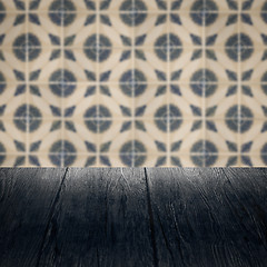 Image showing Wood table top and blur vintage ceramic tile pattern wall