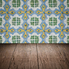 Image showing Wood table top and blur vintage ceramic tile pattern wall