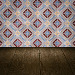 Image showing Wood table top and blur vintage ceramic tile pattern wall