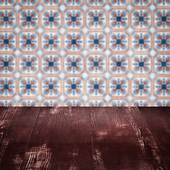 Image showing Wood table top and blur vintage ceramic tile pattern wall