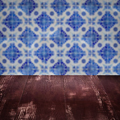 Image showing Wood table top and blur vintage ceramic tile pattern wall