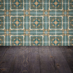 Image showing Wood table top and blur vintage ceramic tile pattern wall