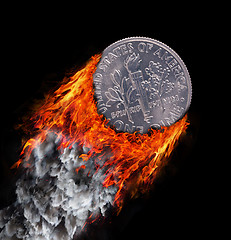 Image showing Burning coin with a trail of fire and smoke