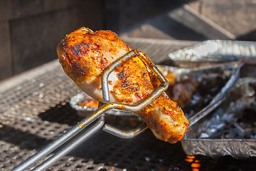 Image showing Delicious chicken is getting ready on bbq