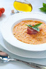 Image showing Tomato soup with bread , garlic , oil , salt and pepper