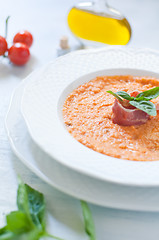 Image showing Tomato soup with bread , garlic , oil , salt and pepper