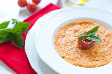 Image showing Tomato soup with bread , garlic , oil , salt and pepper