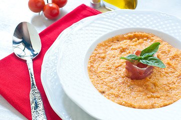 Image showing Tomato soup with bread , garlic , oil , salt and pepper