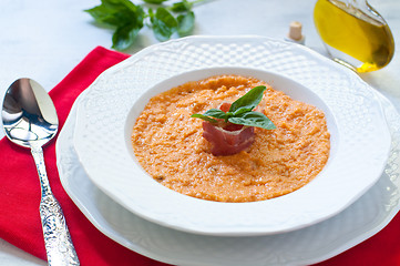 Image showing Tomato soup with bread , garlic , oil , salt and pepper