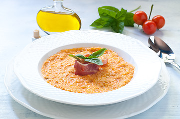 Image showing Tomato soup with bread , garlic , oil , salt and pepper