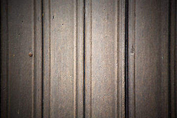 Image showing in london antique brown door  rusty  brass nail and light