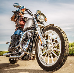 Image showing Biker girl on a motorcycle