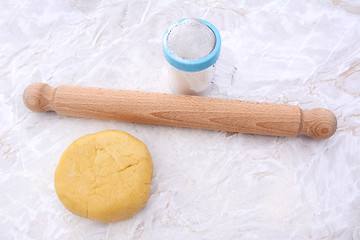 Image showing Shortcrust pastry with a rolling pin and flour drifter