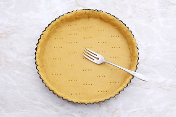 Image showing Fork rests in a pricked pastry pie crust