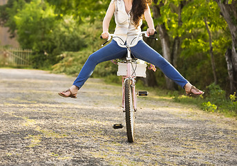 Image showing Happy girl with her bicycle