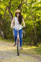 Image showing Happy girl with her bicycle