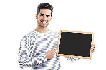Image showing Man holding a chalkboard